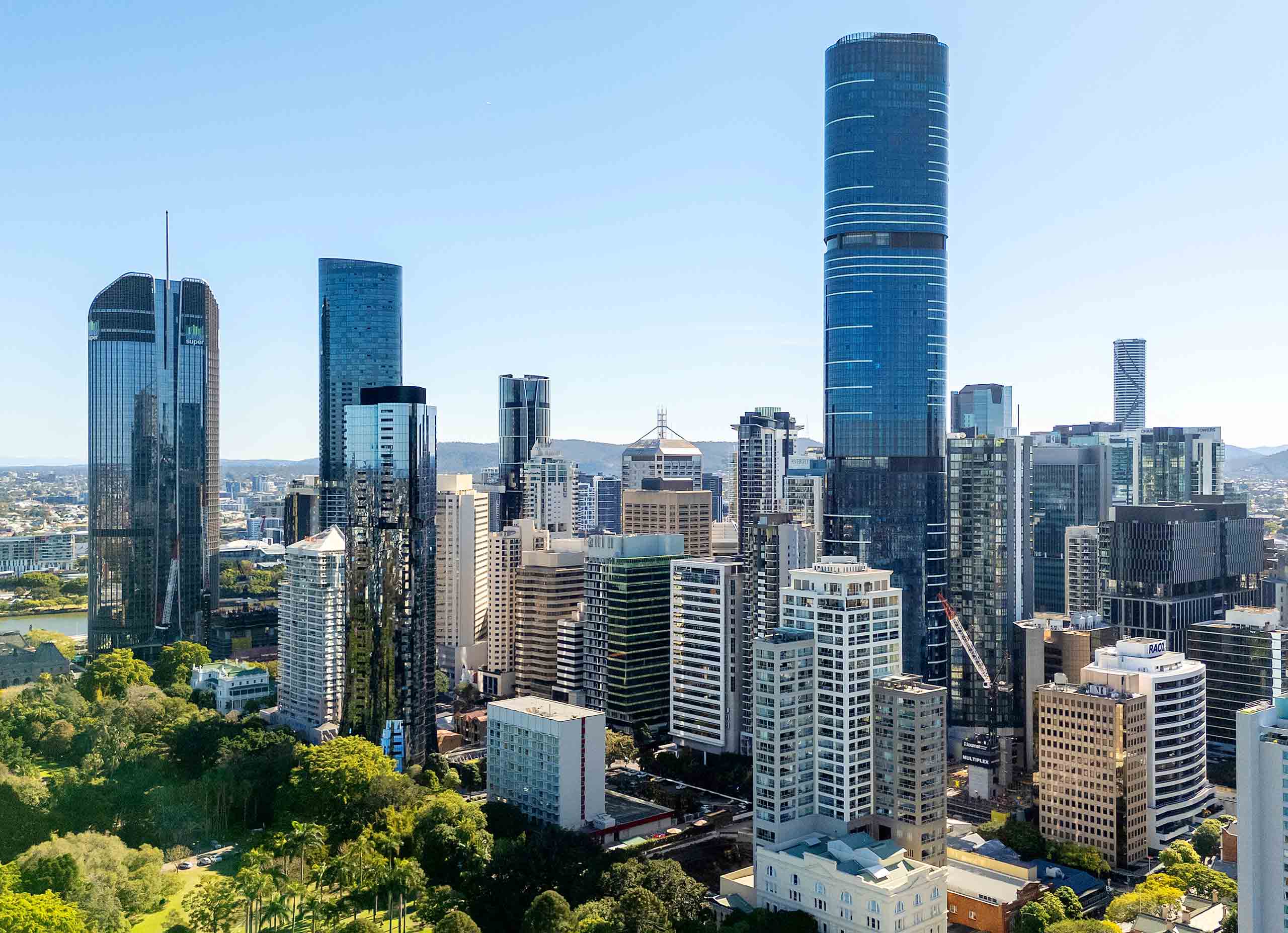 Brisbane Skyline Showcasing Daytime Construction Progress Brisbane city skyline photographed midday featuring new commercial buildings, construction cranes, and landmark structures.
